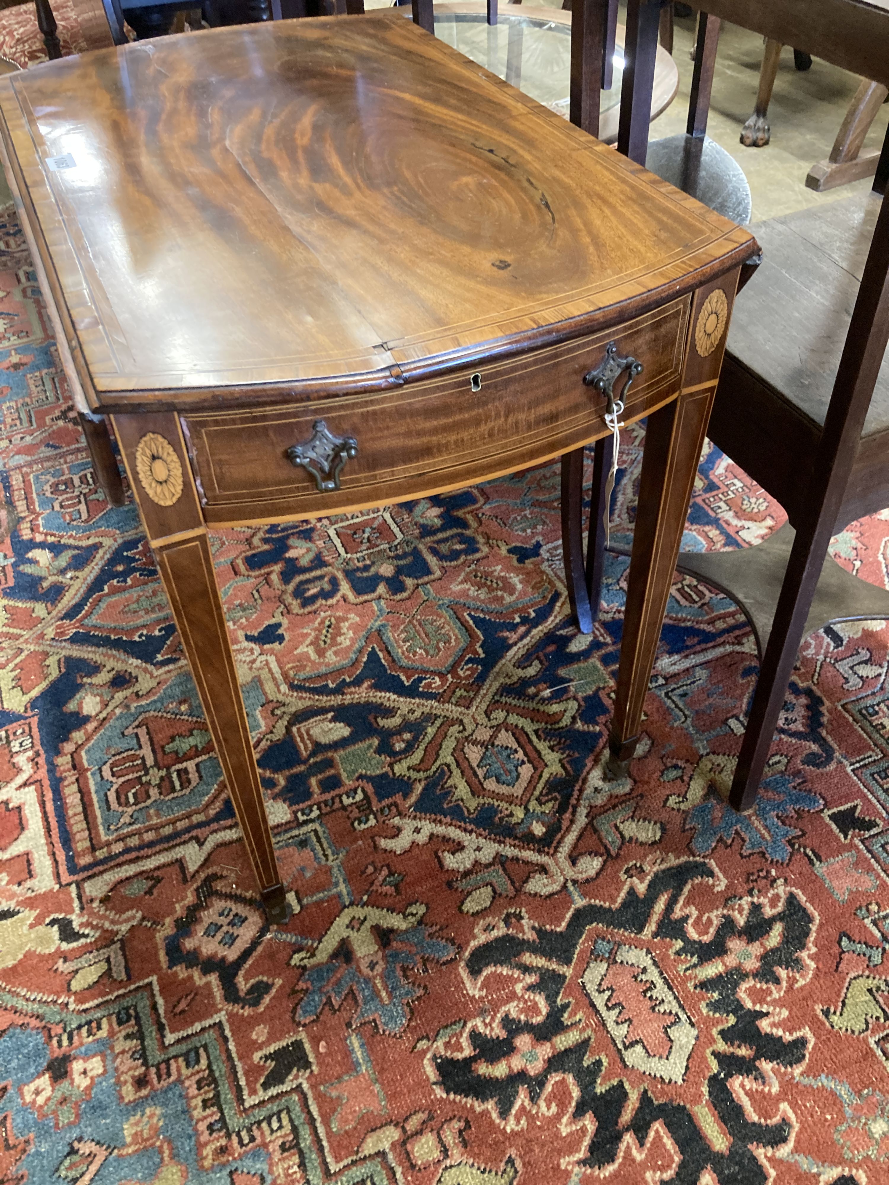 A George III rosewood banded and inlaid mahogany oval Pembroke table, width 79cm depth 49cm, height 68cm